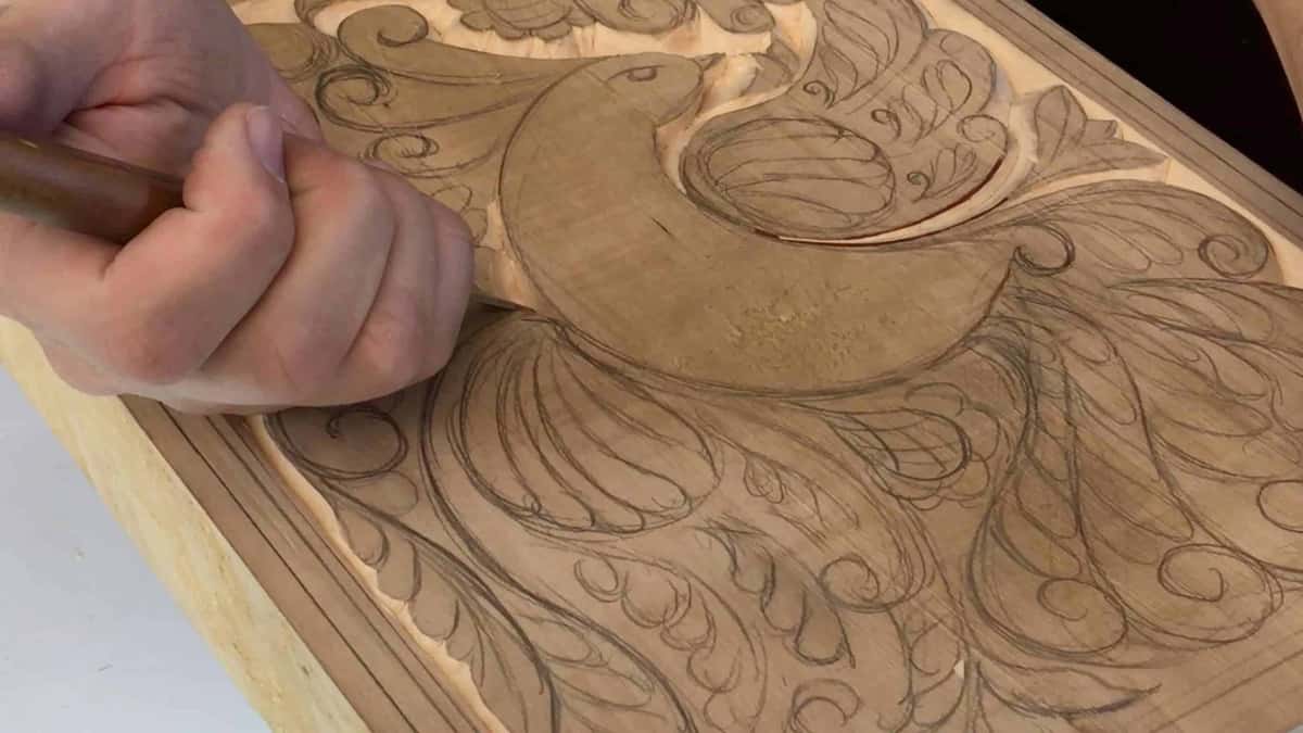 Gouge follows the pencil line, the cut coming up bright behind it