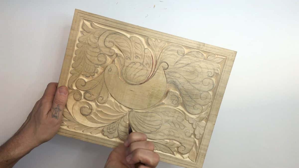 Somebody holds a finished practice panel up to the camera. The pencil lines survived.
