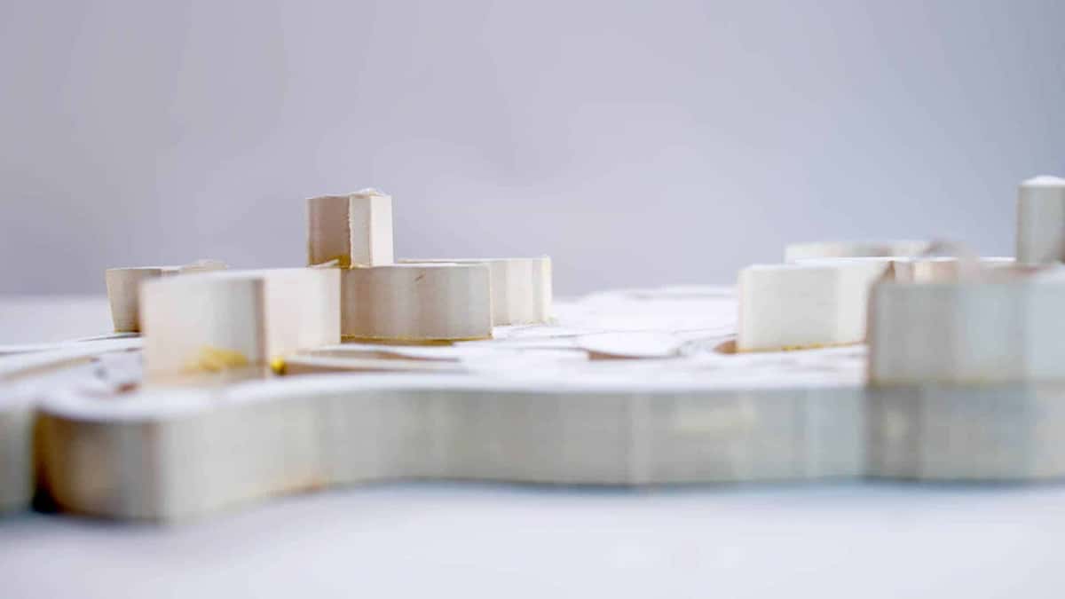 Blocks glued onto a sawn blank to build depth, yellow glue showing at every joint