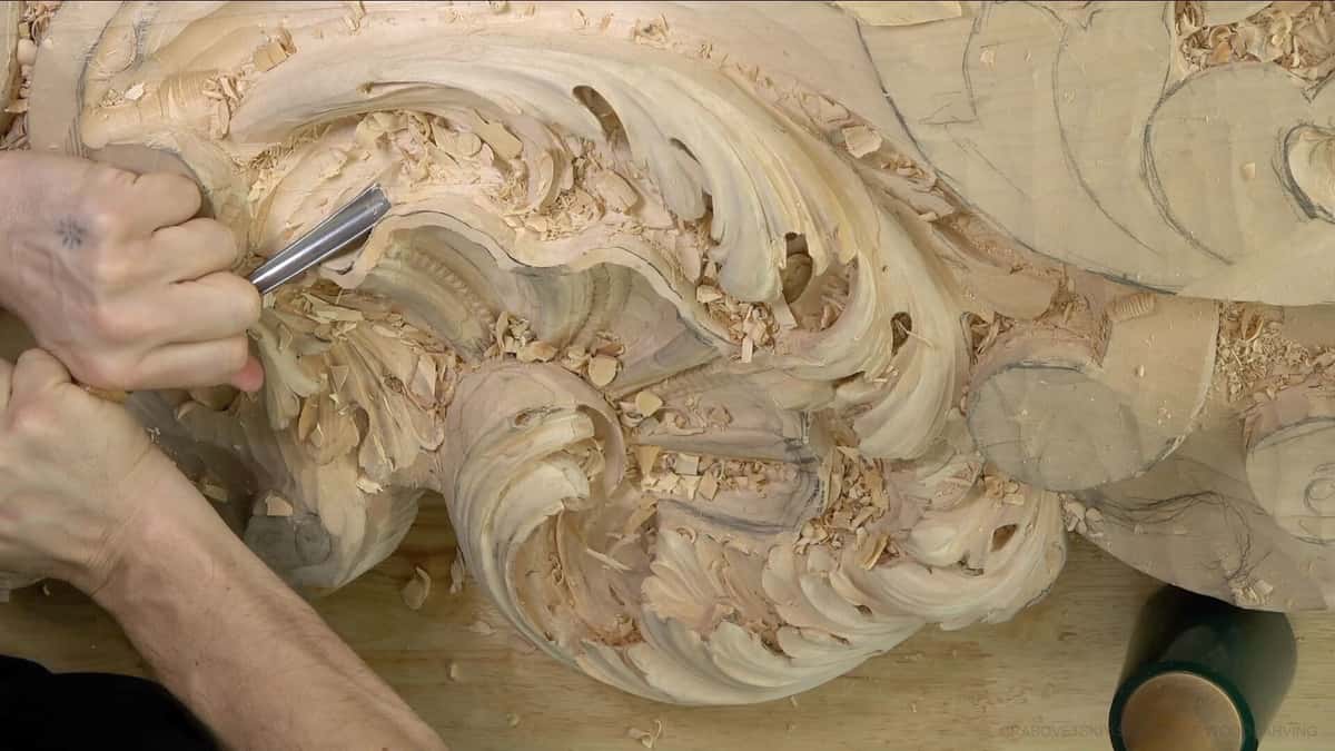 Gouge sweeping along a rococo scroll