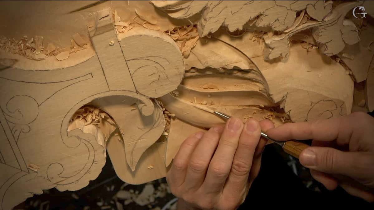 Deep relief panel lit from one side so that every carved shadow reads clearly