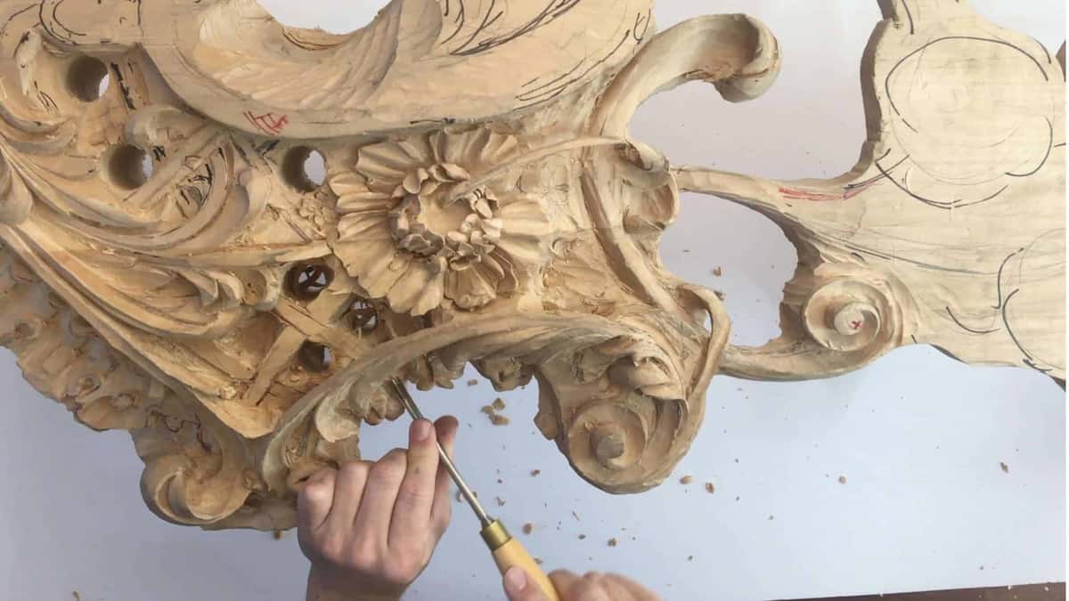 Small gouge working a rosette center inside deeply undercut foliage