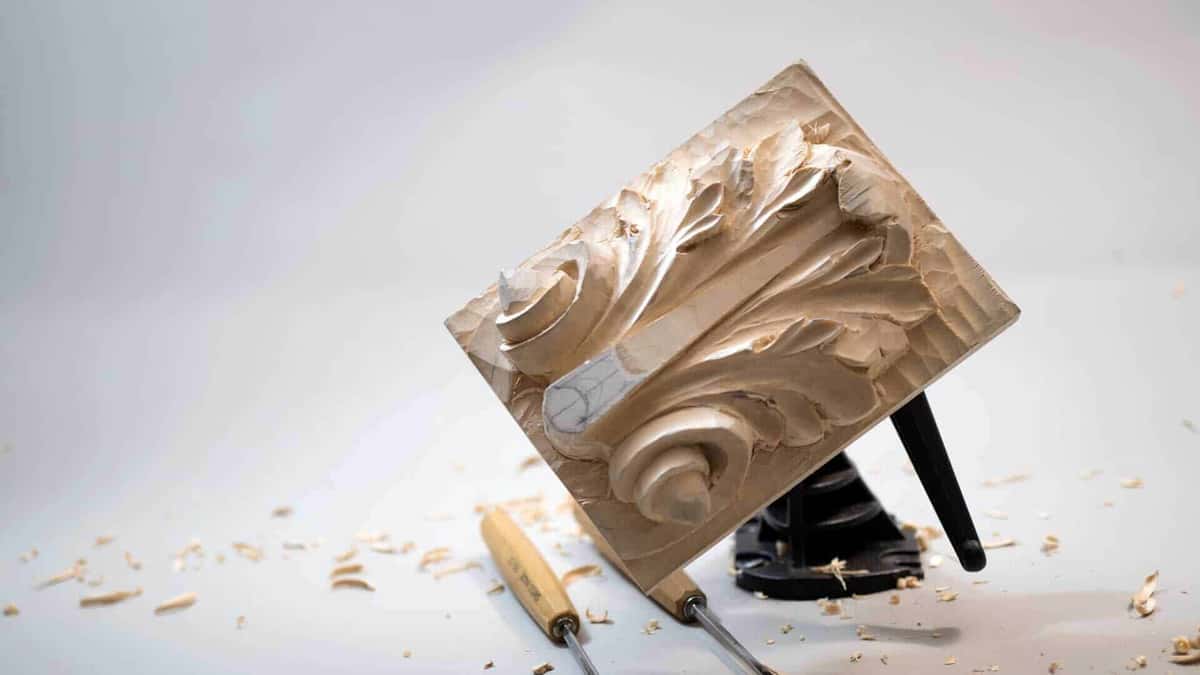Roman acanthus panel propped upright among gouges and shavings