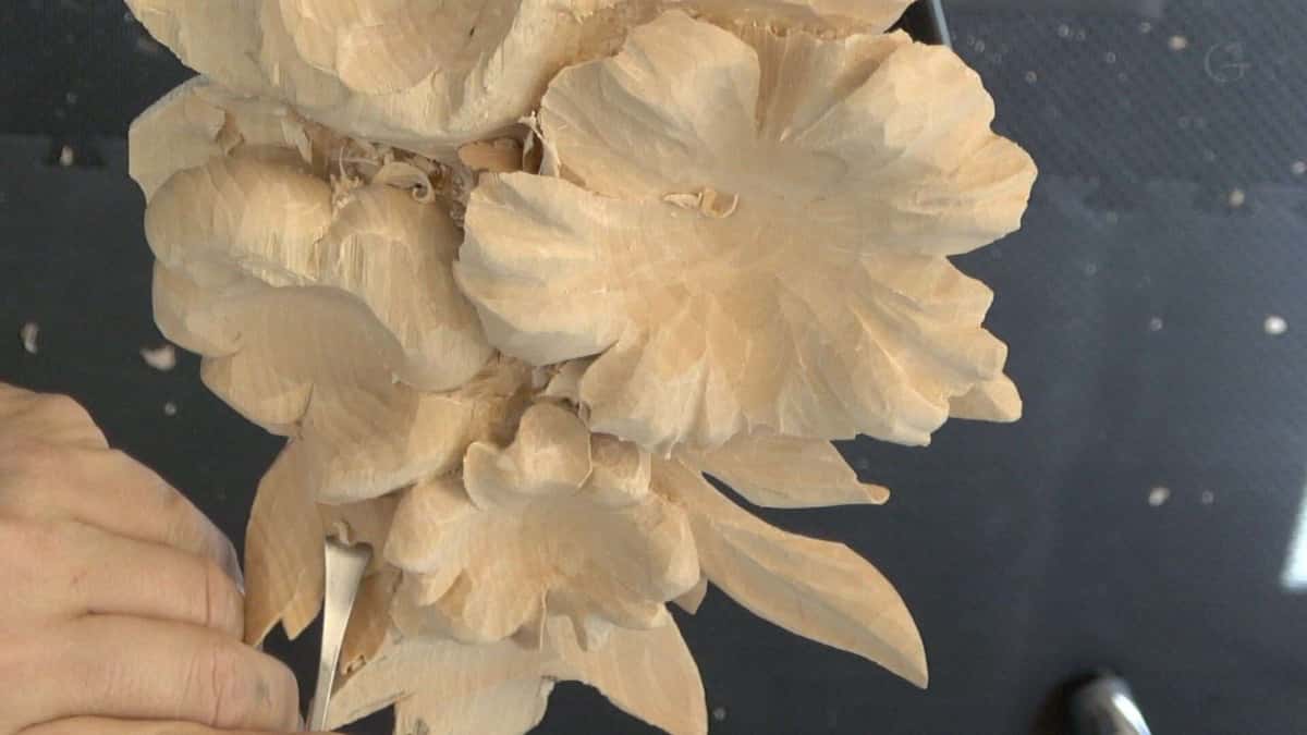 Hashemi flowers roughed in high relief, tool facets still showing