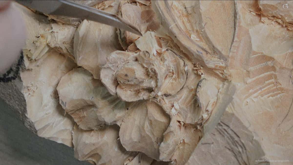 Deep undercut relief in pale wood, where a hard species would resist the edge on every single sideways pass