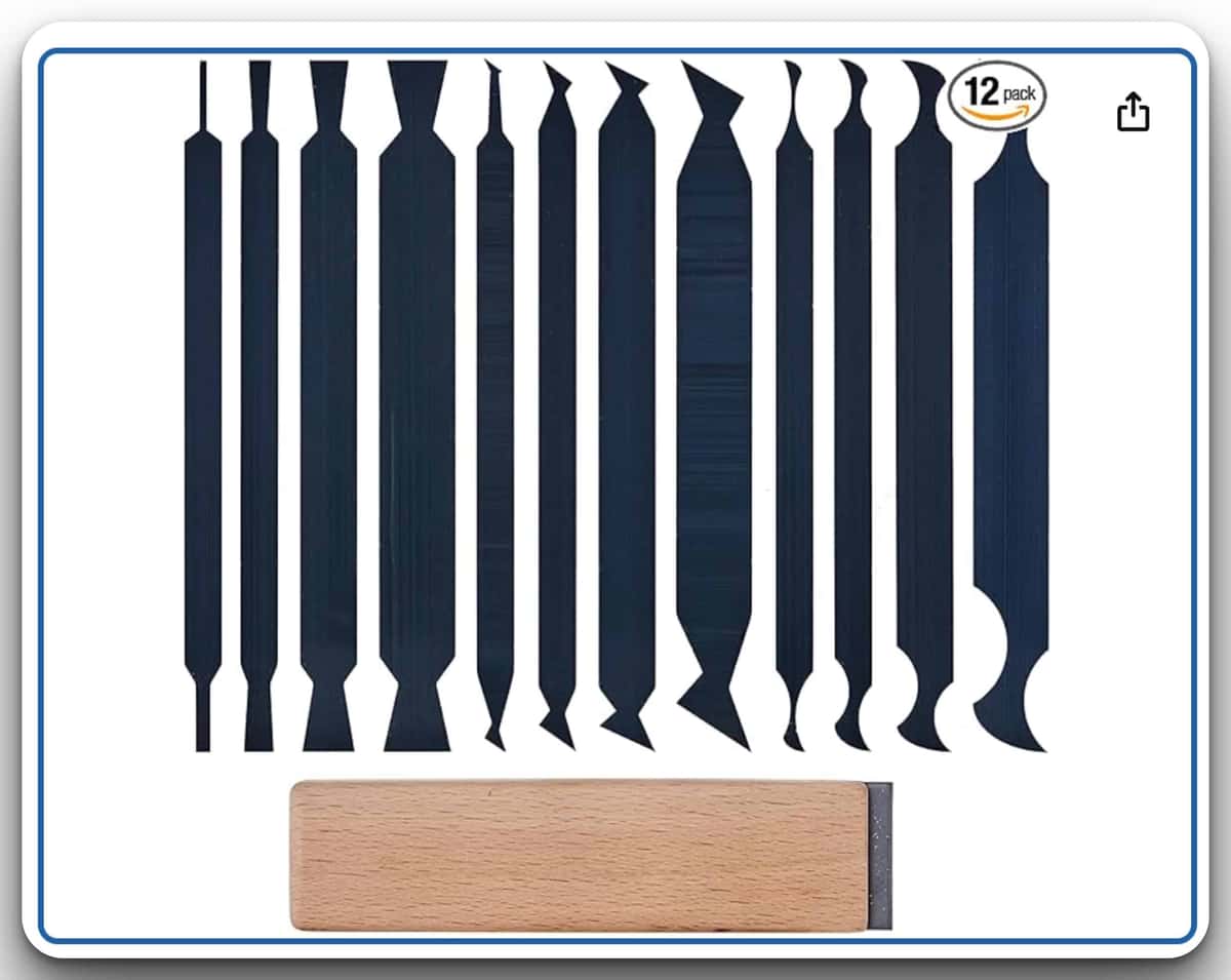 A boxed listing of twelve black double ended carving tools laid in a row above one small hardwood block