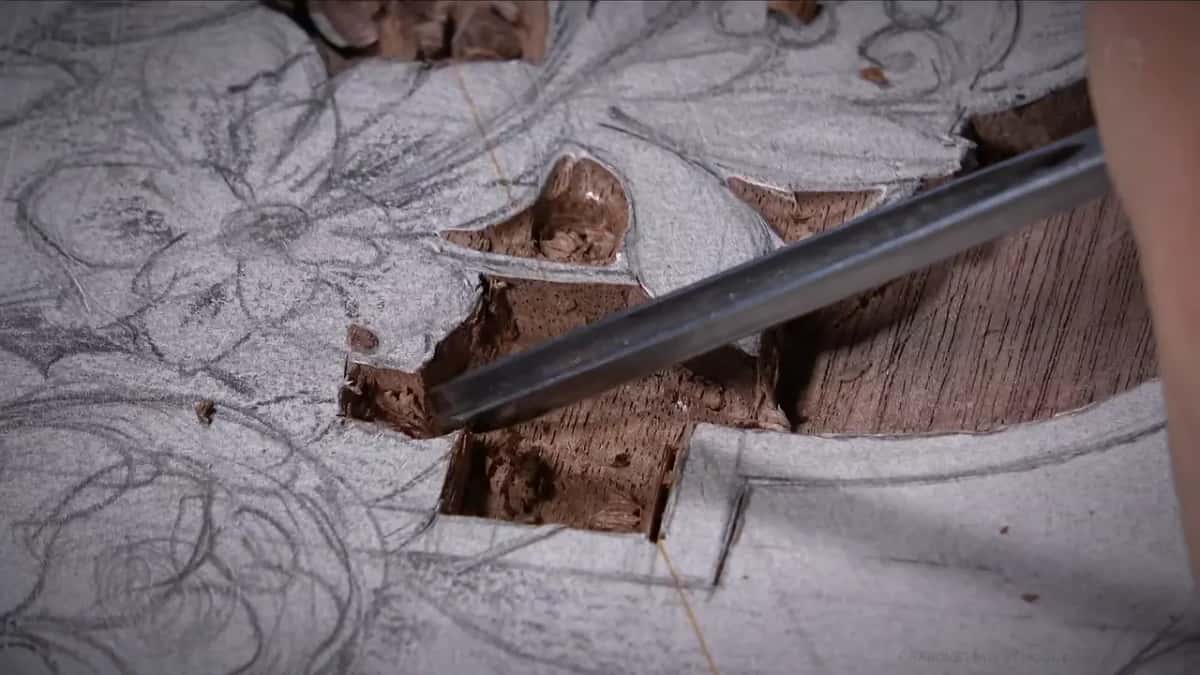 The waste ground here tore instead of slicing clean, leaving fuzzy broken fibre in the reddish brown wood.