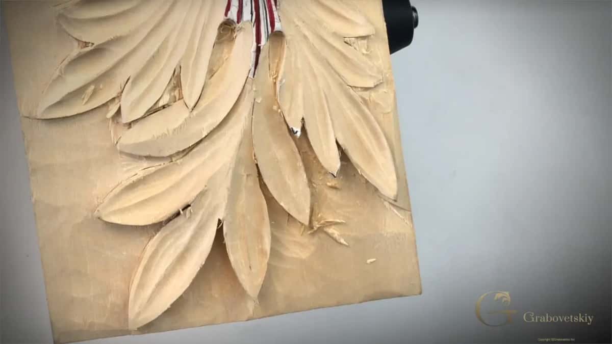 The acanthus panel on its own, every lobe carved deep enough to throw its own shadow