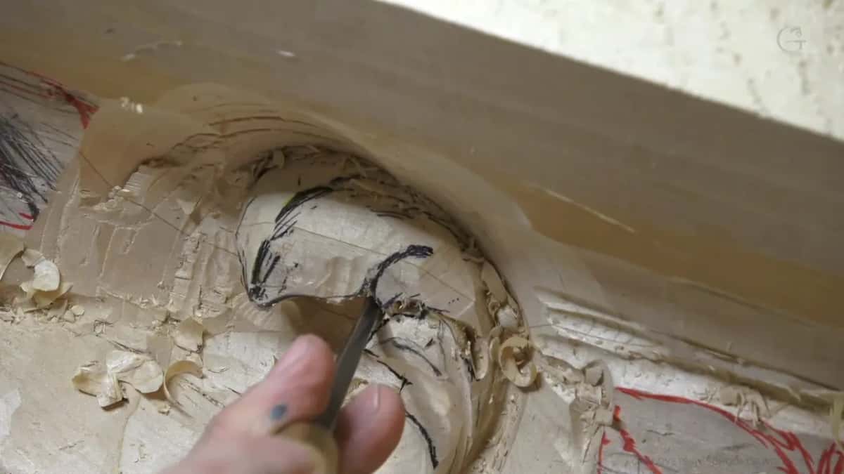 Small gouge following a felt-pen line around a deep hollow scooped out of the leaf form