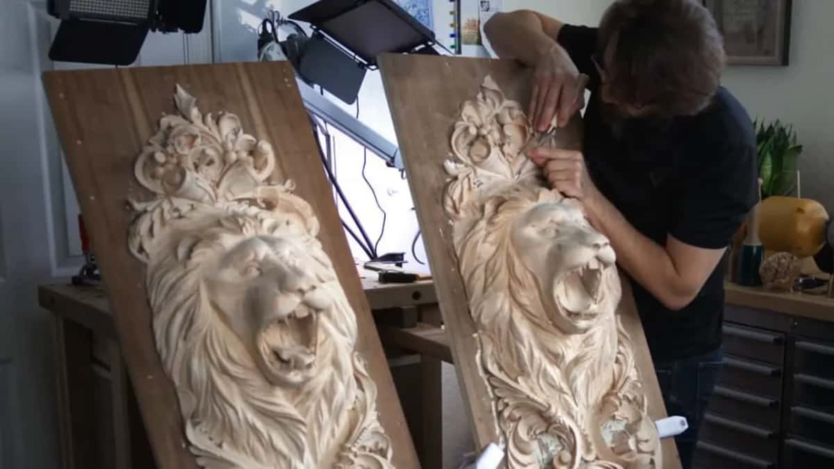 Two tall panels carved with roaring lion heads in high relief, the second one still being worked at the top