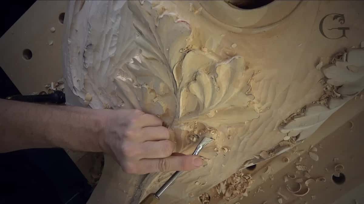 One hand and one tool on the lowest lobe.