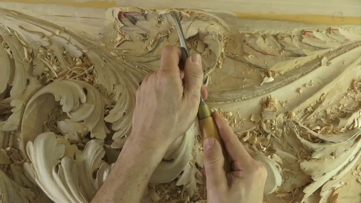 Blade with a wood handle, digging in among loose chips