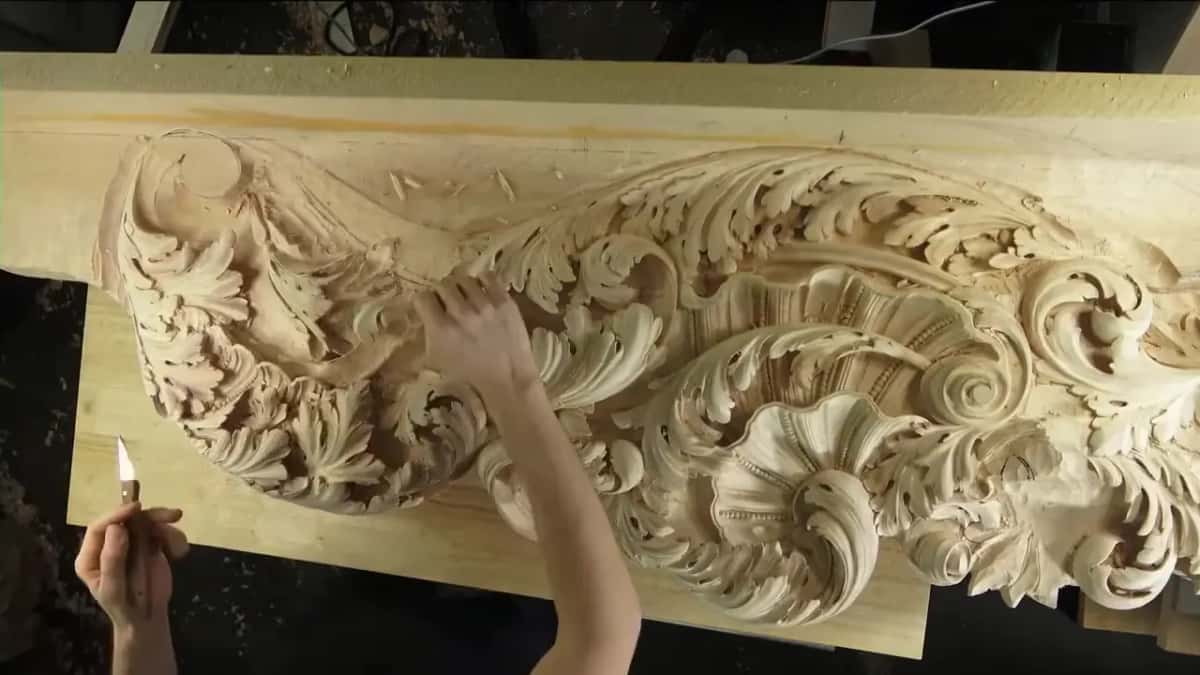 Raised knife beside the big acanthus panel