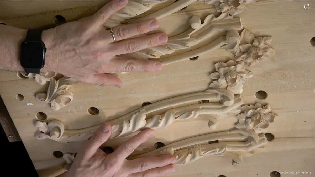 Overhead view of the finished leaf where the deep hollows read almost black against pale wood