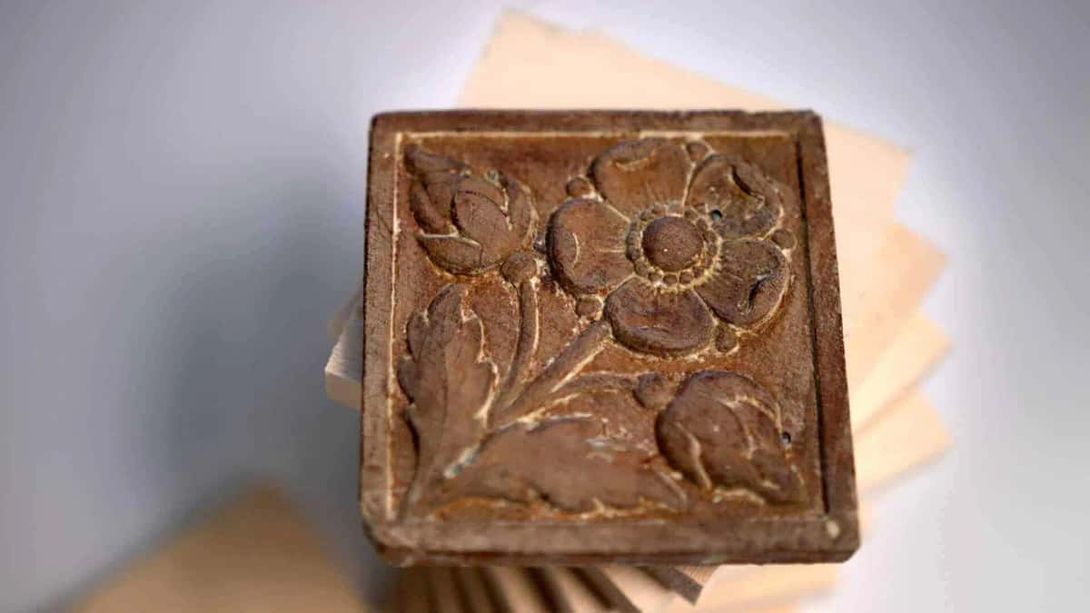 Dark antique flower rosette photographed close up from above