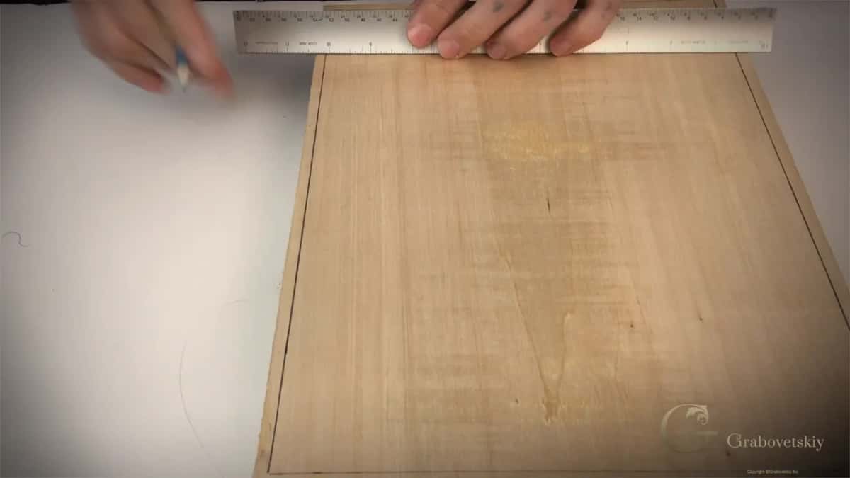 Border lines pencilled in around all four edges before any of the design goes on