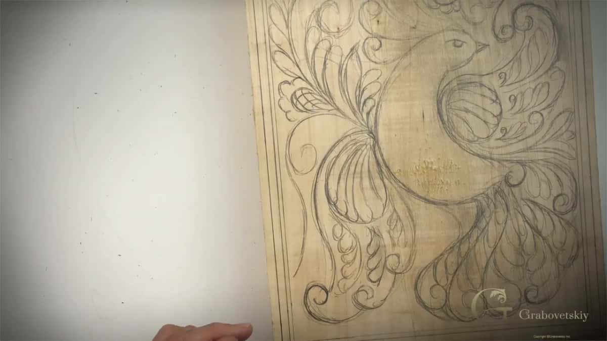 Curls, leaves and flowers filling every space around the bird in one free flowing design