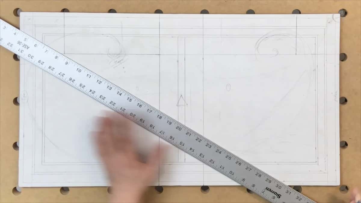 A long ruler laid corner to corner across the board while the diagonal goes down