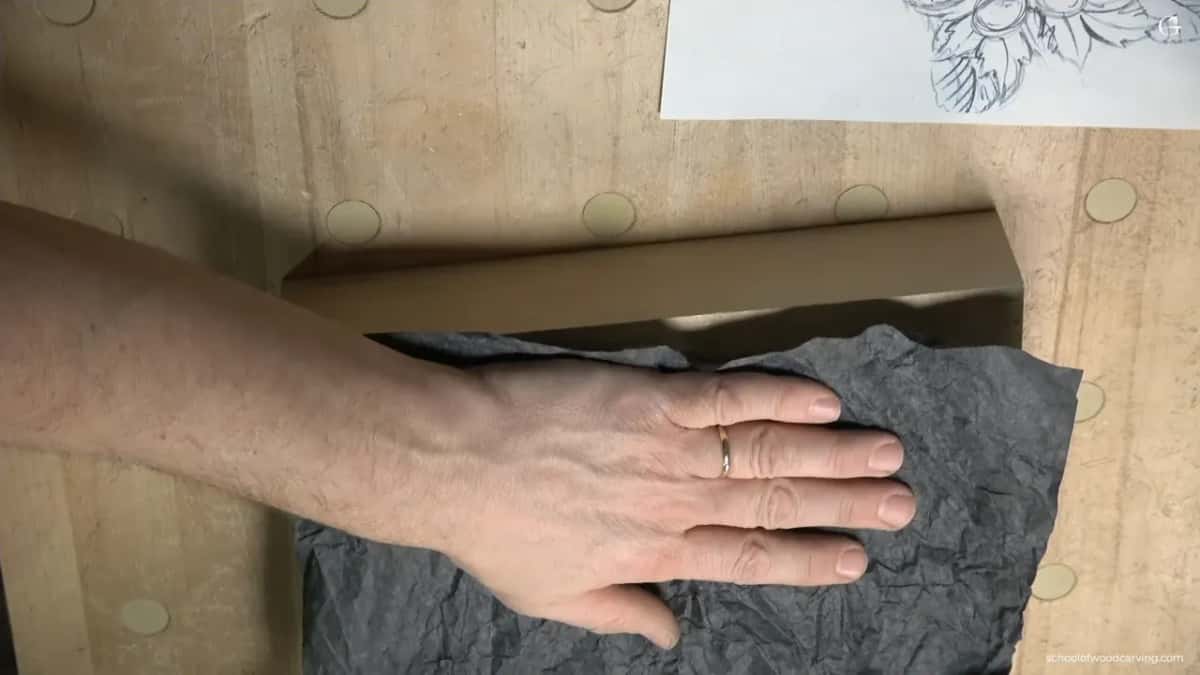 Transferring the hazelnut outline onto the flat board with an old piece of carbon paper
