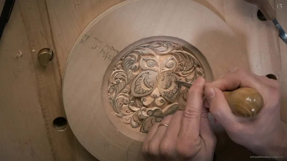 Close view of basswood where the grain reverses direction under the blade during a beginner carving cut