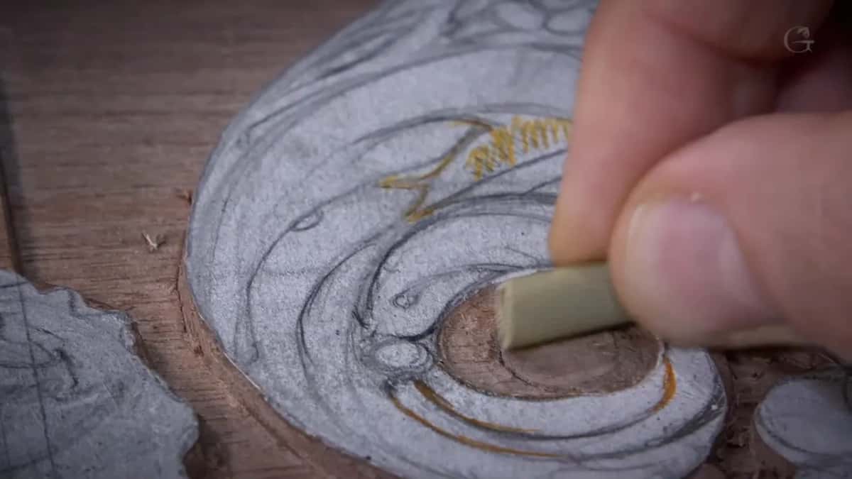A scroll shaded in graphite so every high and low spot reads, one hollow being rubbed with a stick.