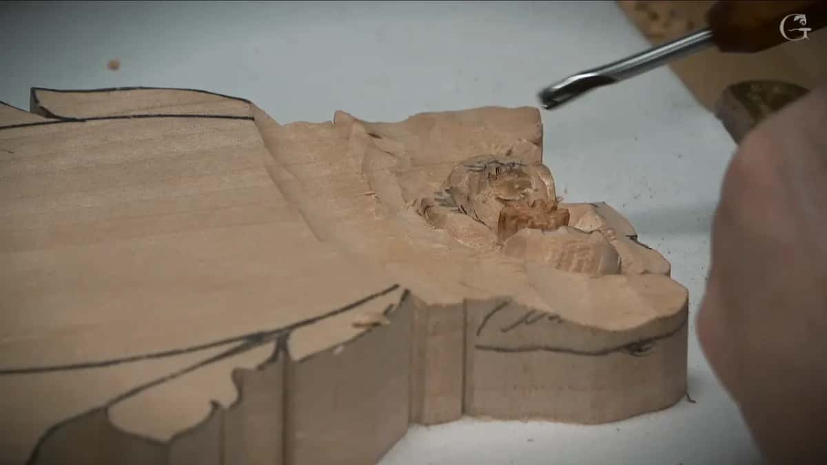 A sawn step in a pale blank turns long fibres into short exposed ends.