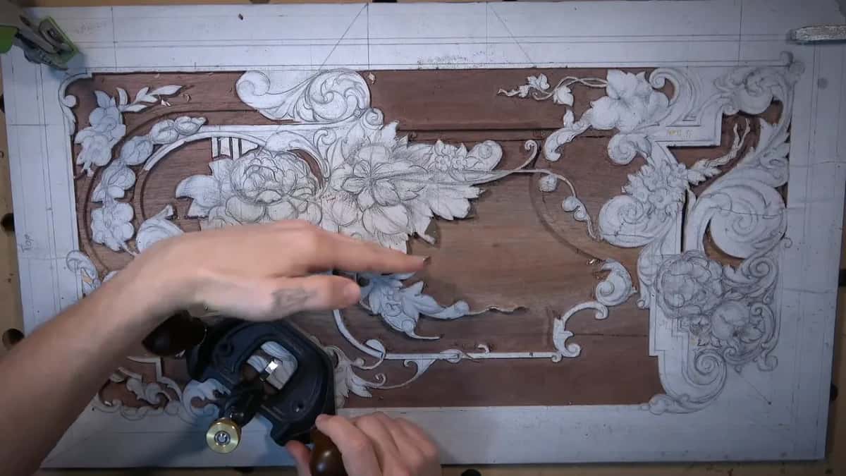 A whole furniture panel drawn out in chalk and pencil, part of it modelled, a brace at one side.
