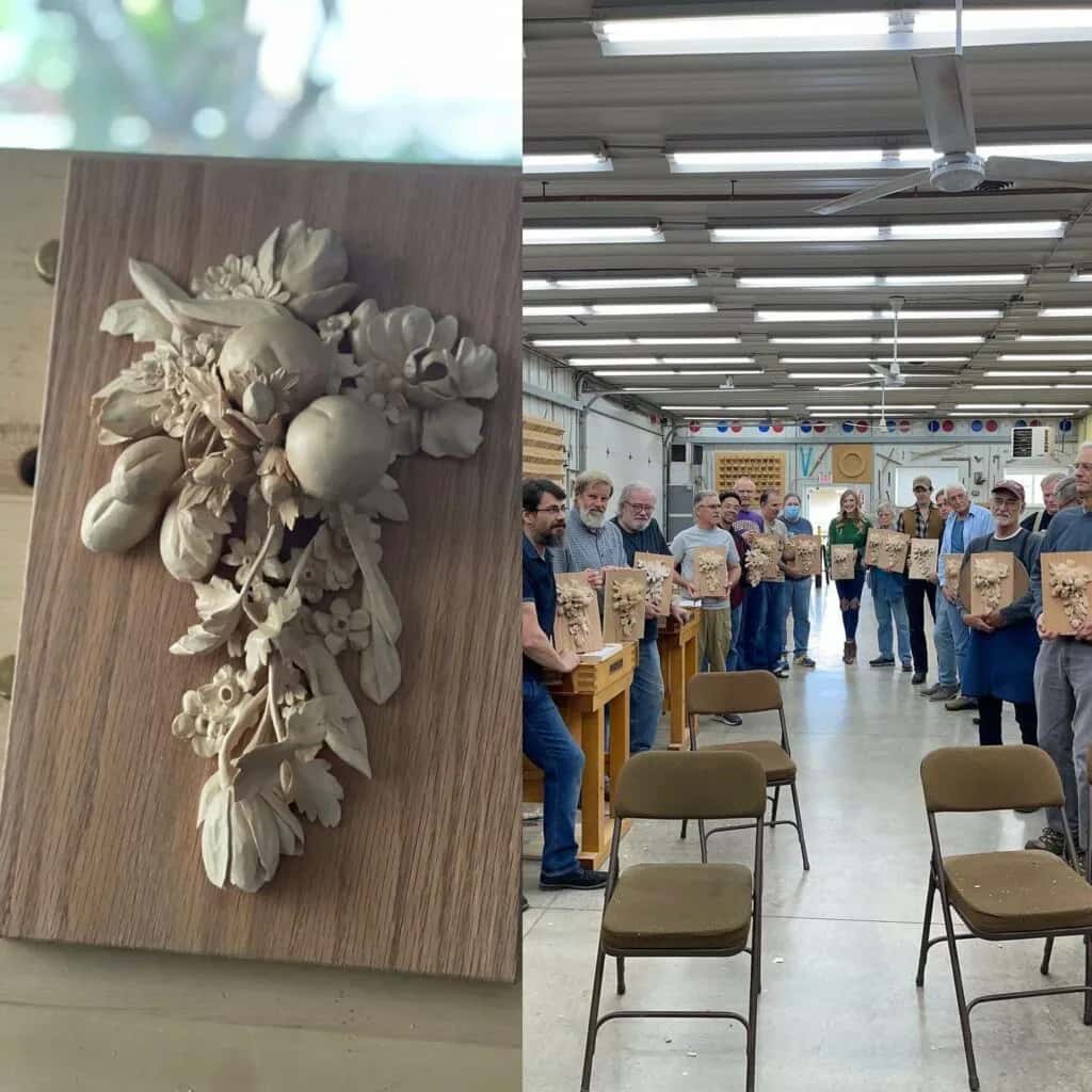 A carved panel on a wall, and behind it a photo of a full class standing in a woodworking school shop