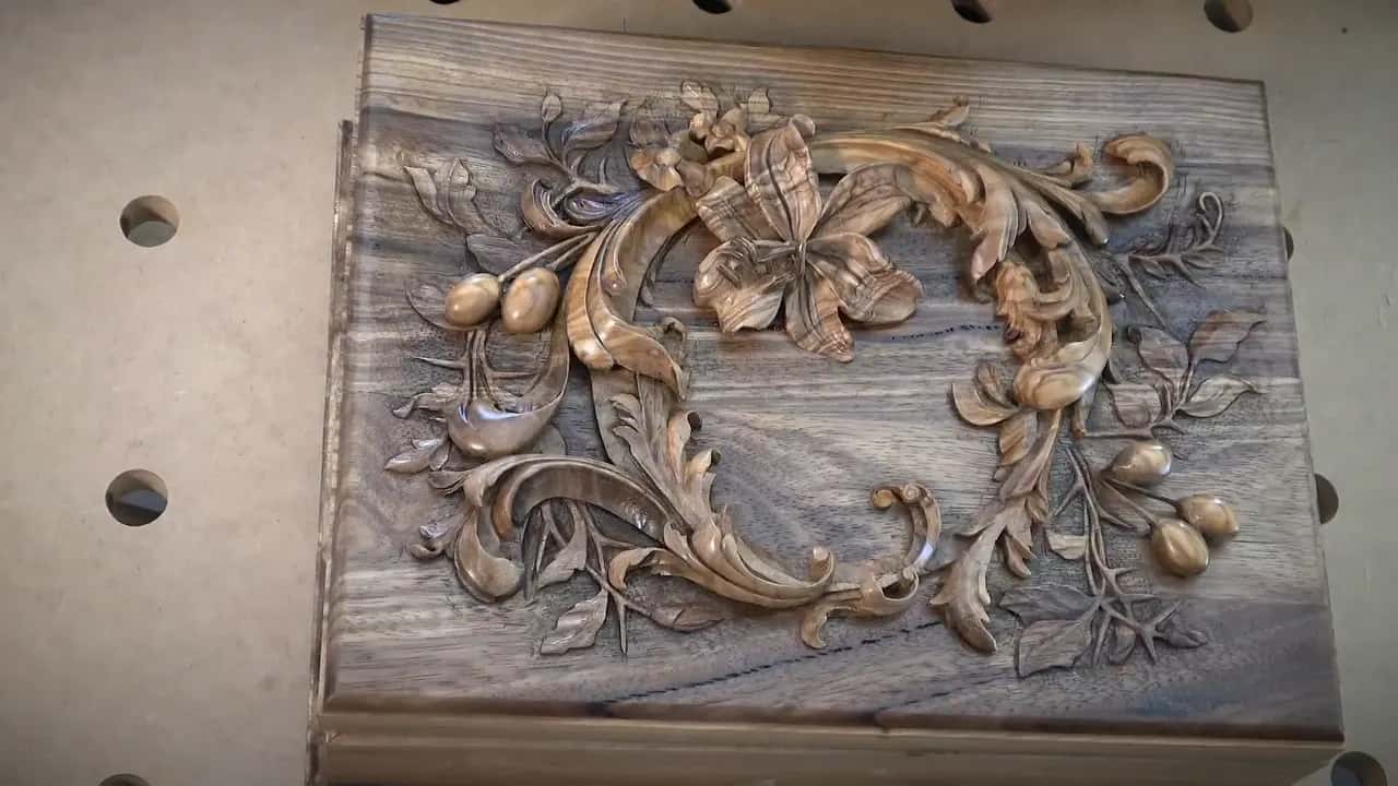 How many coats of lacquer should I apply for a durable finish on carving?