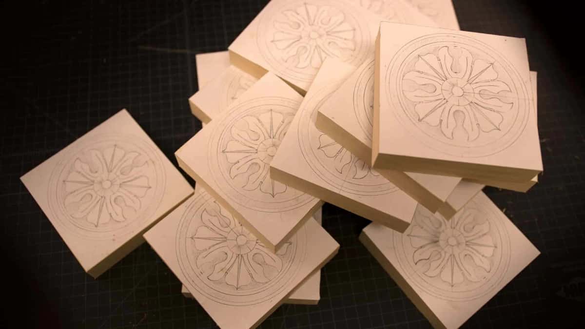 Basswood blanks with the paper rosette pattern glued down and the design drawn in pencil