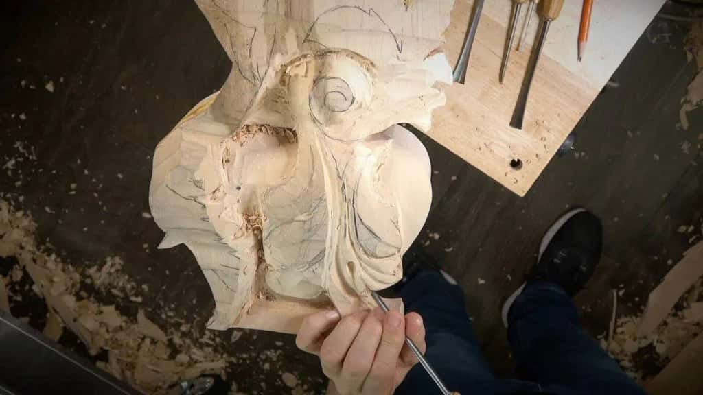 Working a carved element down on the floor, seen from where I stand over it