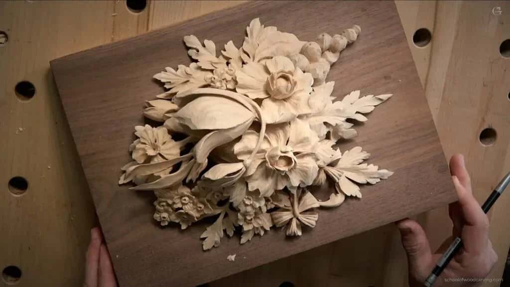A Grinling Gibbons style spray of flowers and foliage in high relief basswood