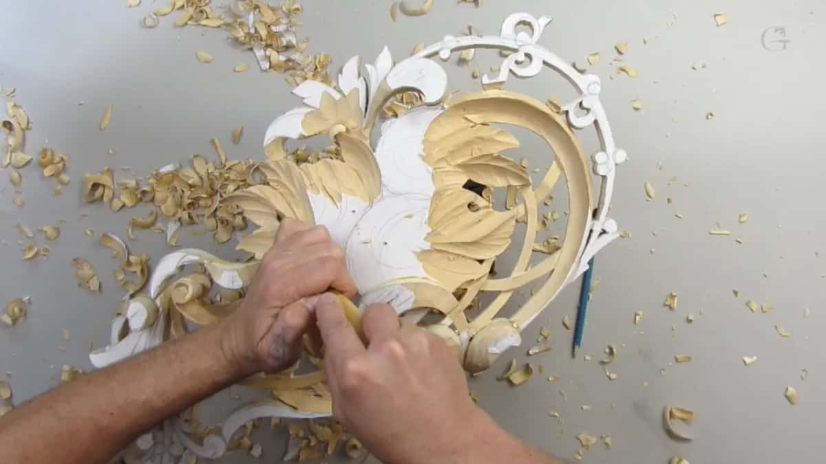 Both hands on one tool at the lower edge