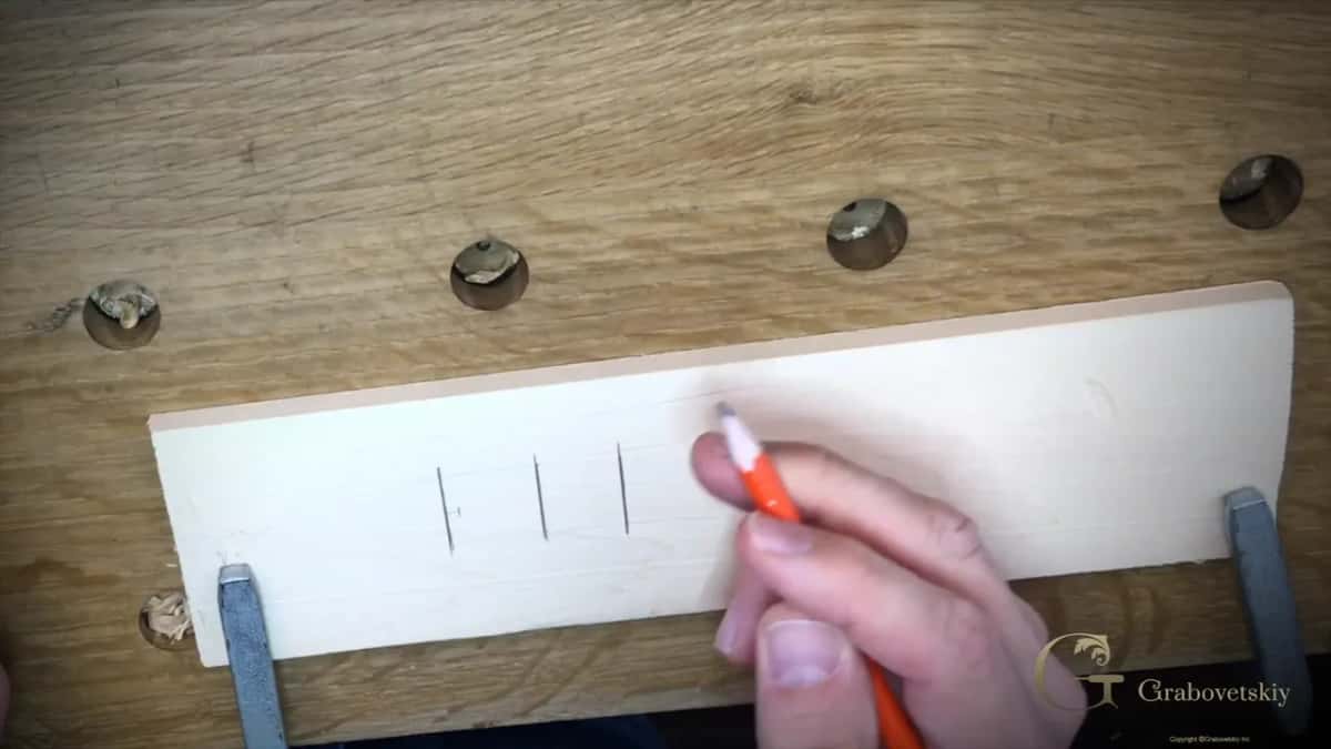 Point marked about five millimetres out from the line, roughly three sixteenths, where the angled cut begins
