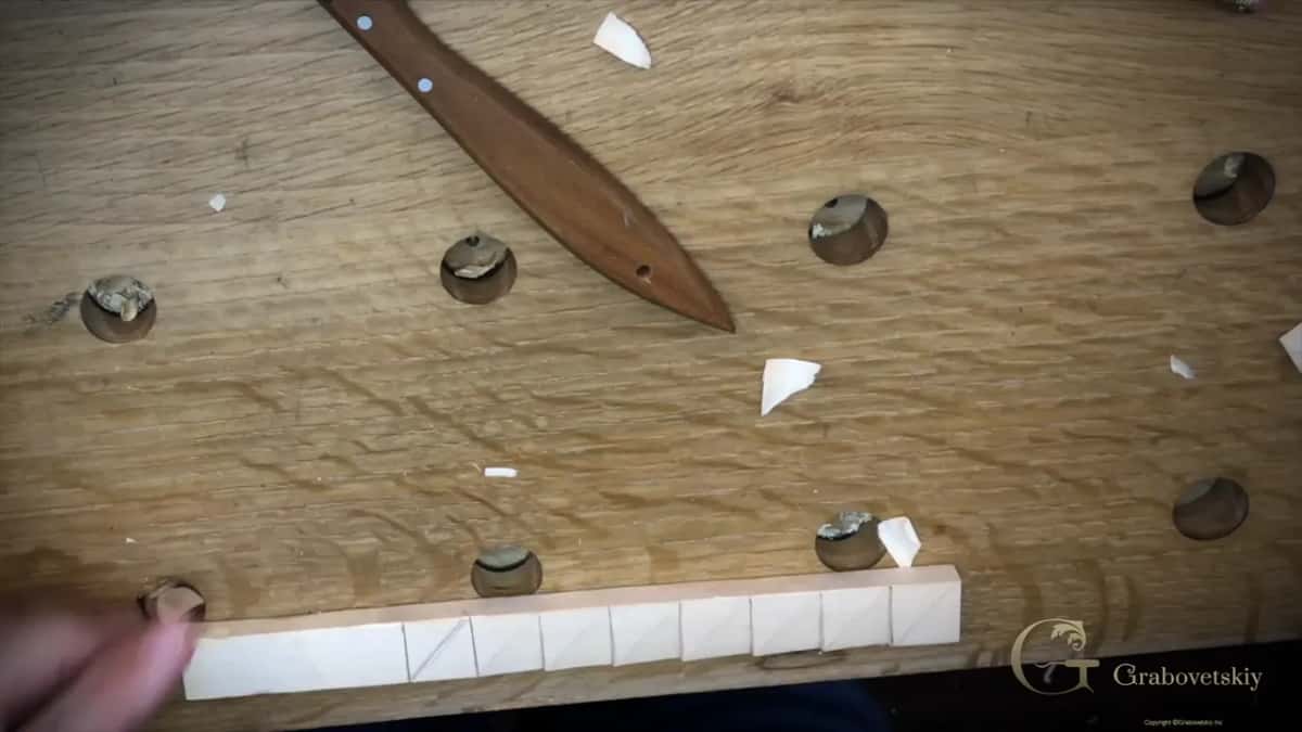 Knife laid down beside the divided strip