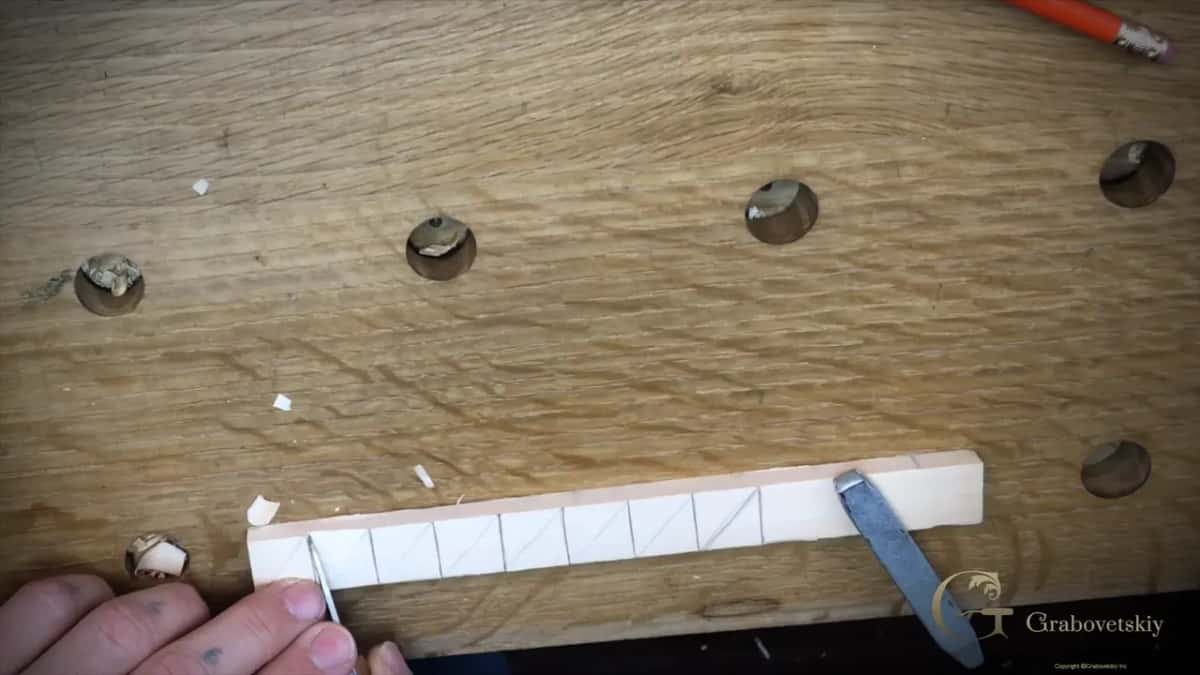 Strip marked with diagonals, chips on the bench beside it