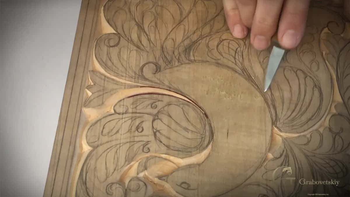 A knife splitting one line into two bevels so the flower grows from the middle.