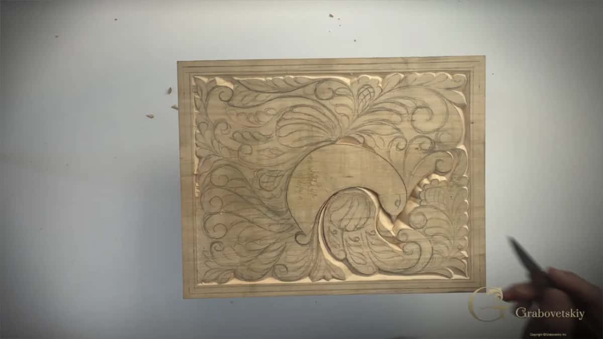 Three volutes rolling into each other along the tail.