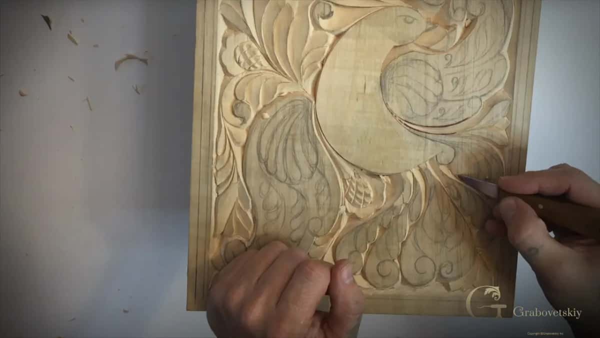 Following the whole curl in one continuous stroke.
