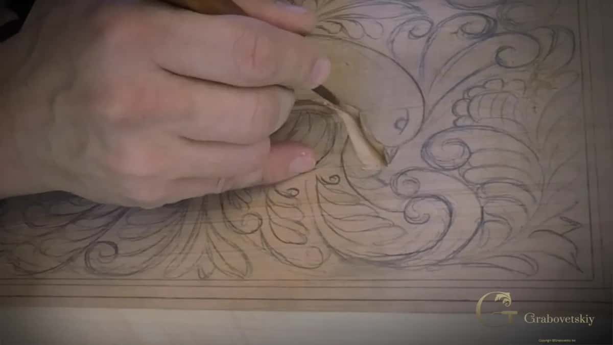 Thumb on the carved wall. No sandpaper touches this panel at any point in the project.