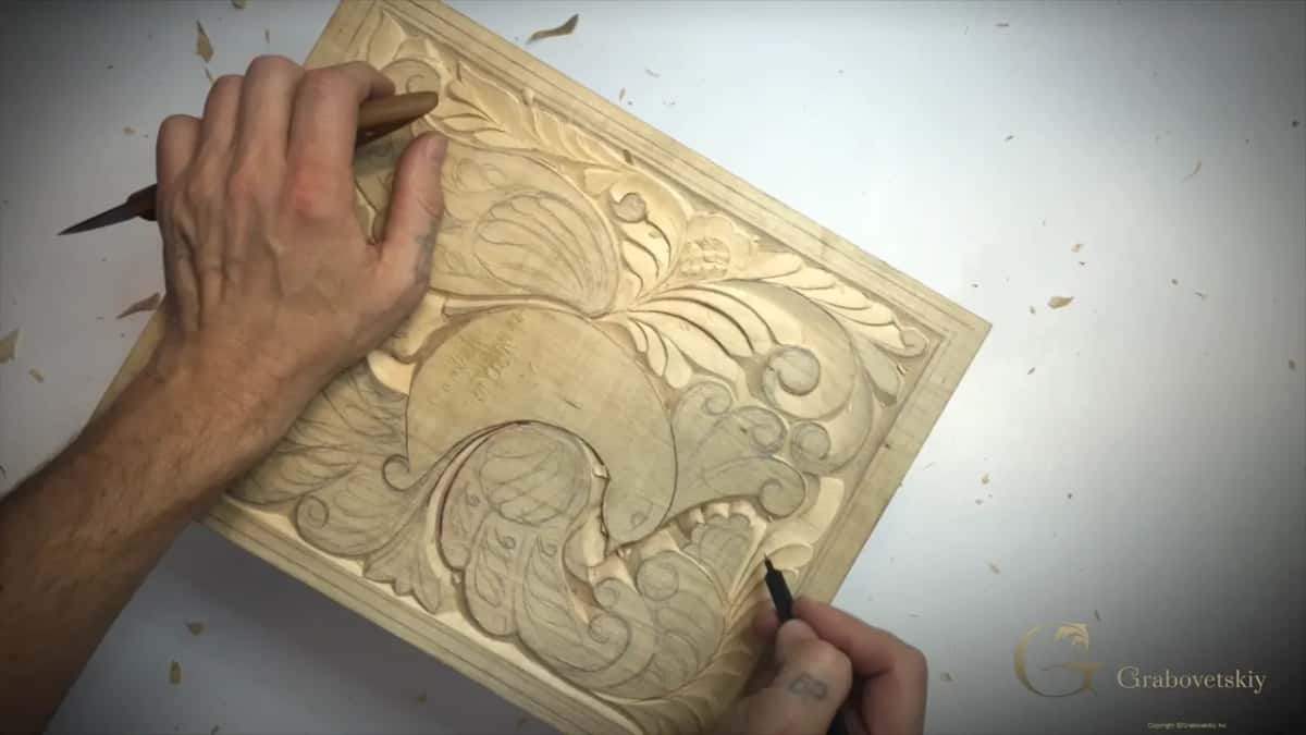 Pencil back on the board, redrawing the second flower a little differently from the first.
