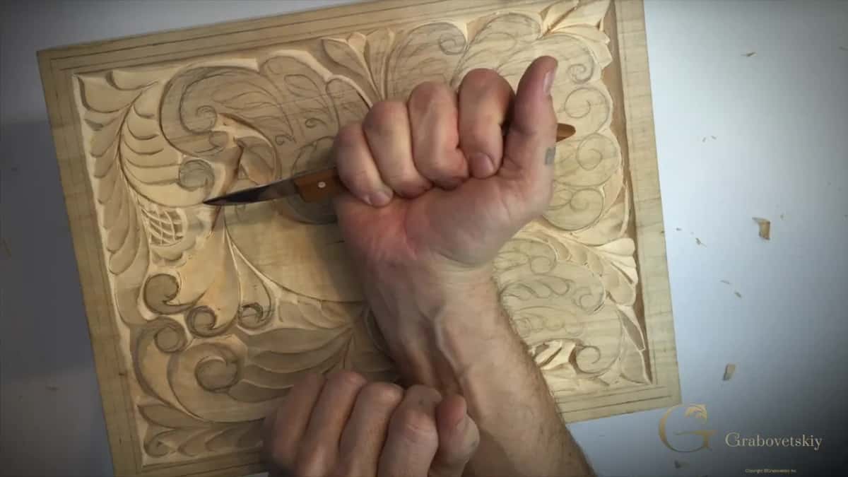A different hold for a low pass, because a hand flat on the board cannot drop any lower.