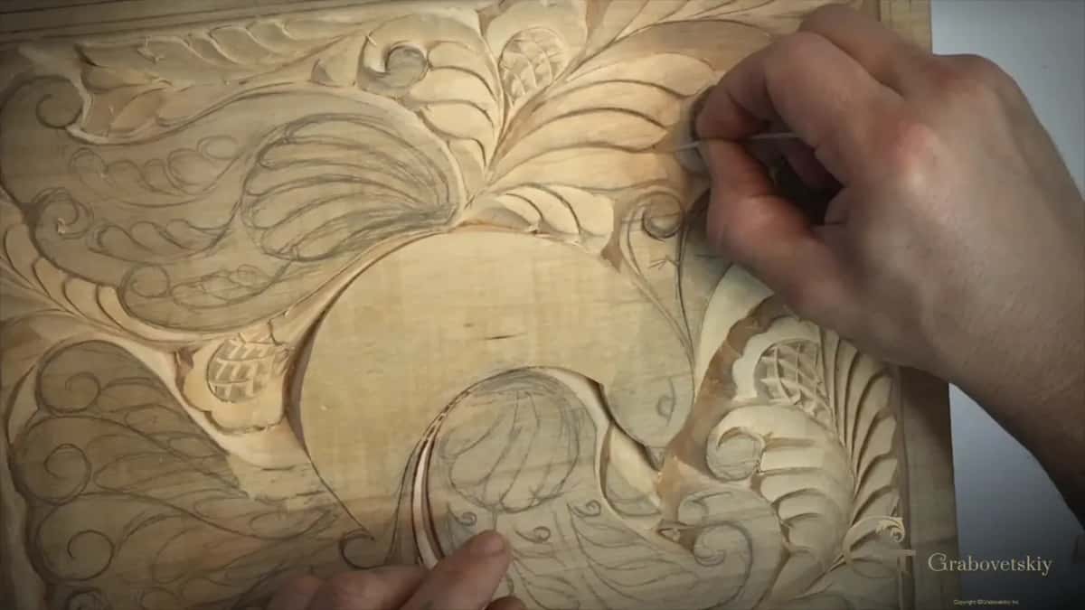 Rubbing the low point of the V from either side in turn.
