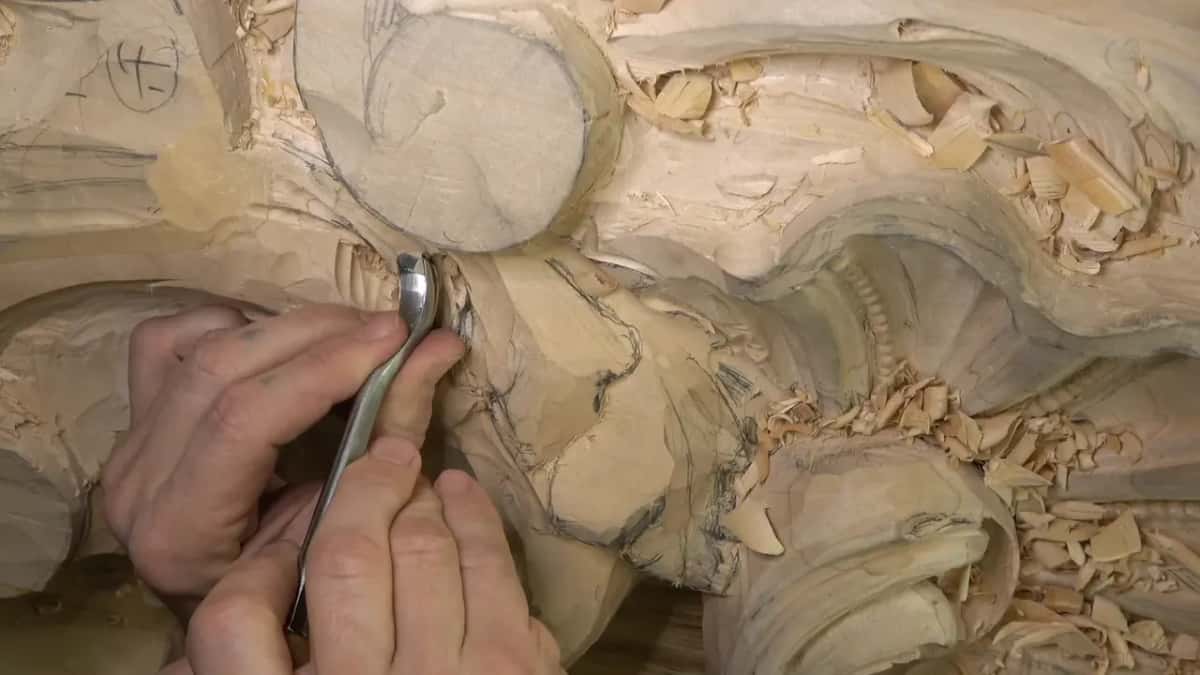 Bent spoon gouge, two hands.