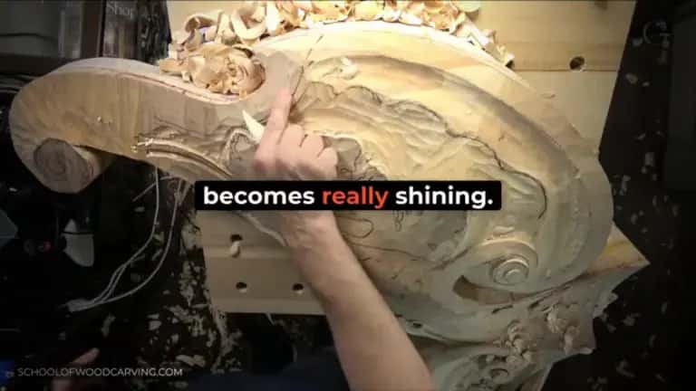 Rubbing a chip over a big carved scroll