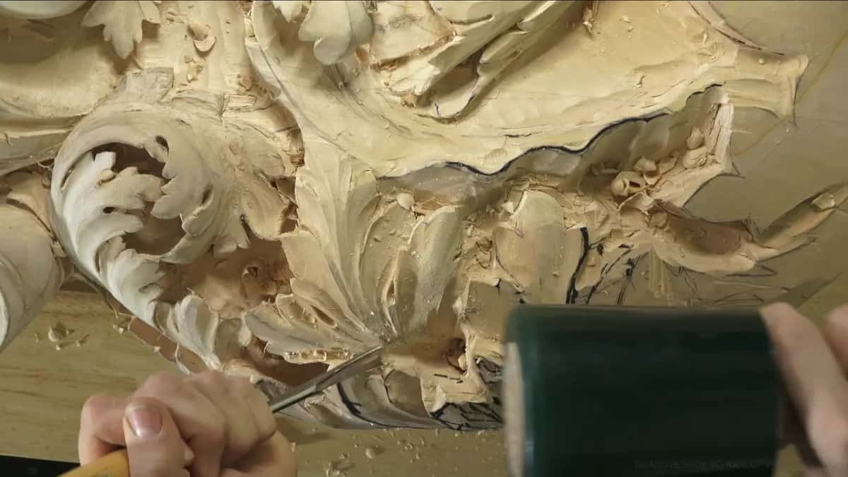 Gouge and mallet working a leaf