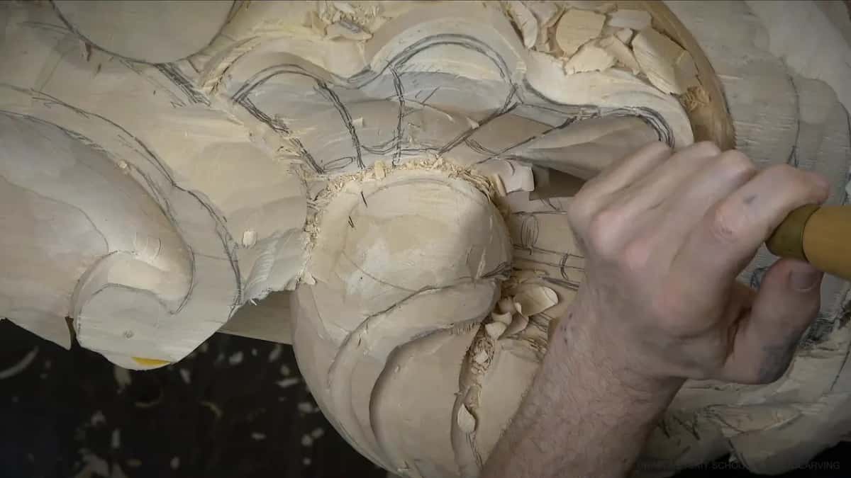 A yellow handled gouge sits low in the fan, with pencil lines around it