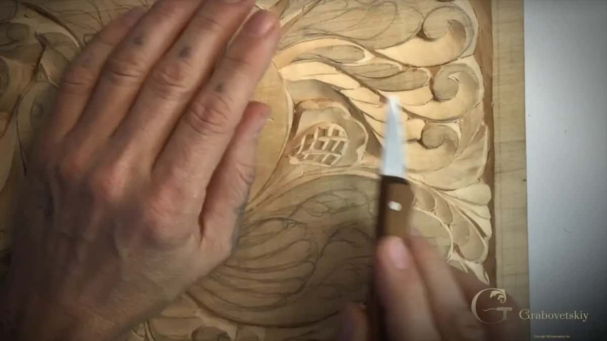 Knife at the curl, free hand flat.