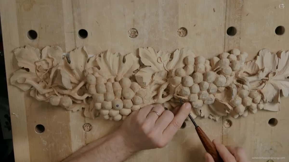 Slicing rather than pushing, the handle swinging well over while the edge barely travels