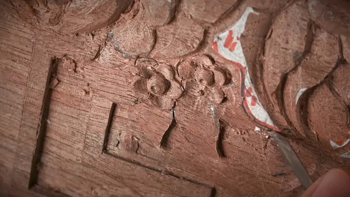 Blooms finished, chips scattered, carved leaves running away into the corner
